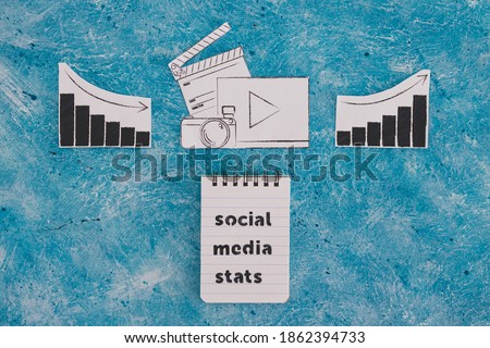 creative content and social media success conceptual image, photo and video digital content icon with stats going both up and down