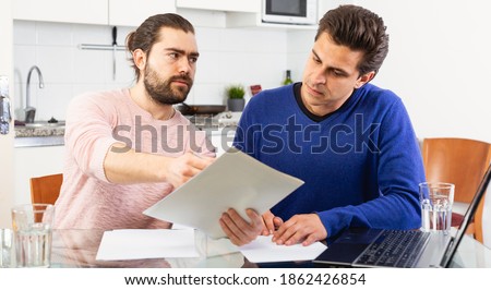 Men discuss the terms of a contract. High quality photo