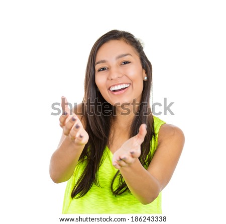 Closeup portrait, young beautiful smiling, happy excited woman with raised up palms arms at you offering something, isolated white background. Positive emotion facial expression signs symbols