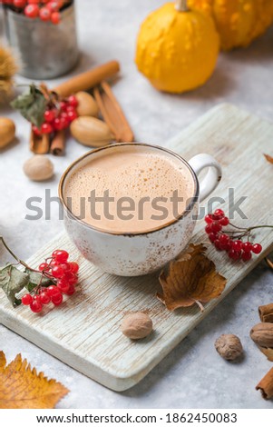 Pumpkin latte in mug. Autumn drink for Halloween or Thanksgiving.