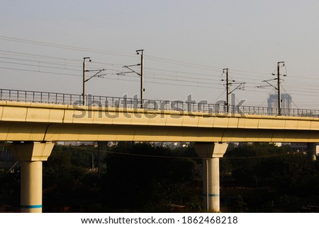 A picture of indian metro train bridge with selective focus