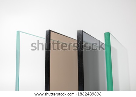 Sheets of Factory manufacturing tempered clear float glass panels cut to size. Royalty-Free Stock Photo #1862489896