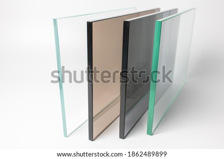 Sheets of Factory manufacturing tempered clear float glass panels cut to size. Royalty-Free Stock Photo #1862489899