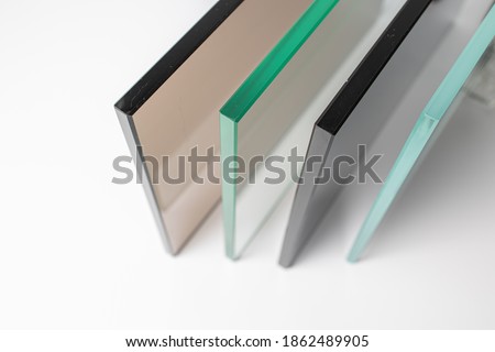 Sheets of Factory manufacturing tempered clear float glass panels cut to size. Royalty-Free Stock Photo #1862489905