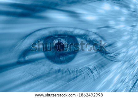 Female eye close-up with blue light waves