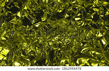 Aluminum background, silver foil metal with uneven and warped shiny surface