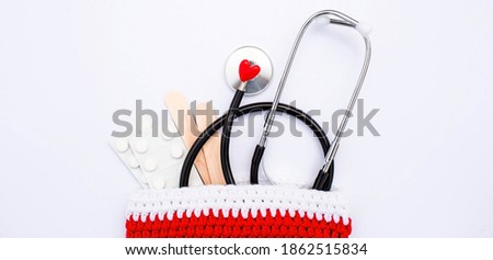 Banner. Medical banner 2021 for clinics with pills, stethoscope and Christmas tree on a white background. Copyspace. Medicine new year flatlay.