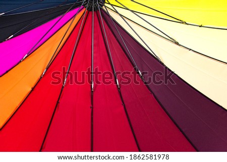 Multicolored umbrella dome from the rain. Abstract color background