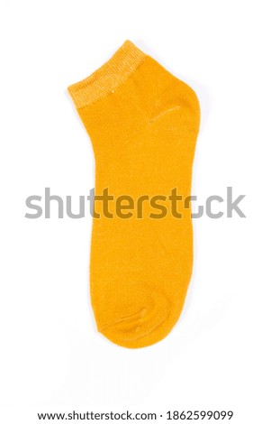 one yellow short sock on a white background, top view
