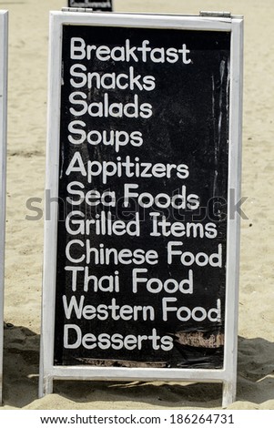 board with a list of dishes in a cafe on the beach of the Indian Ocean Colombo
