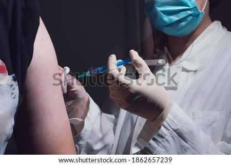 People getting covid-19 vaccine close up Royalty-Free Stock Photo #1862657239