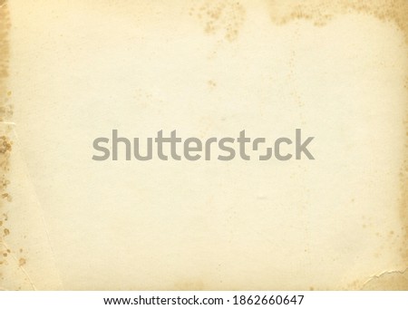 Retro photo paper texture. Old antique paper texture. Vintage paper background. Aged and yellowed postcard. Royalty-Free Stock Photo #1862660647