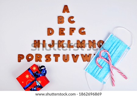 Gingerbread christmas alphabet with Face protection mask on the white background, Christmas 2021
