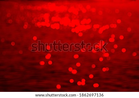 Red abstract background with blurred bokeh. Blurred lights background. Abstract bokeh lights with soft light background. Bokeh pattern. Wallpaper. Bokeh background