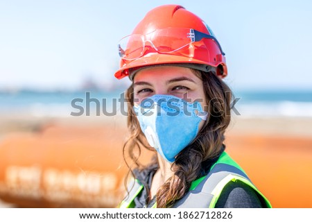 Occupational safety and health specialist with face mask for coronavirus (covid-19). Occupational health is a multidisciplinary field of healthcare concerned with enabling an individual. Royalty-Free Stock Photo #1862712826