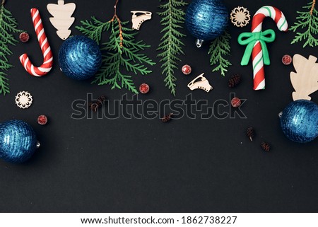 New Year's, festive decor on a black background. Copy space, flat lay, mock up, top view