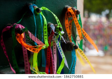 Colored votive ribbons: "Souvenir of Salvador" at the door of the Nosso Senhor do Bonfim church.