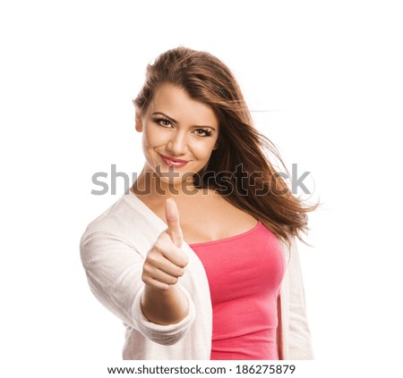 Happy young woman with thumbs up isolated on white background
