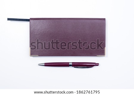 Purple Pen and Purple Cover Notebook on white Background