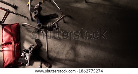 Background studio floor of filming or making of video production that include professional equipment such as many electric light wire and tripod and dolly wheel on it and look messy and a bit dirty