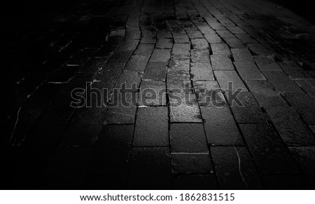 Tiles on wet floor of urban street, construction and architecture