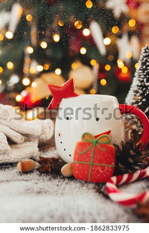 christmas still life with cup of coffee, cookie and decorations
