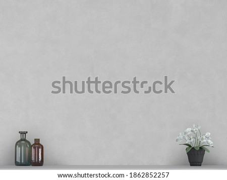 Decorative glass bottles, white orchid flower on table with white wall background.