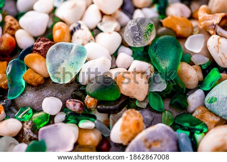 Colorful sea glass found on the coast. High quality photo Royalty-Free Stock Photo #1862867008