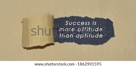 Motivational quote written on brown torn paper 