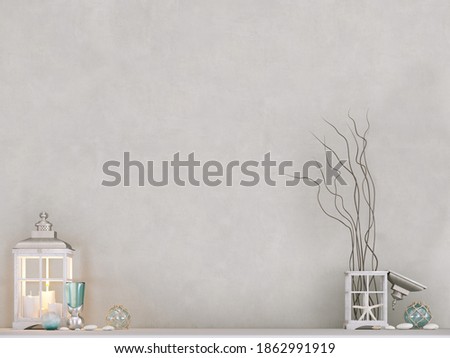 Close-up on lantern and decorative elements on white table with white wall background