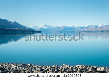 Beautiful Lake Pukaki with Mt Cook reflected in its bright turquoise waters Royalty-Free Stock Photo #1863010303