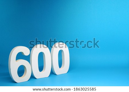 Six Hundred ( 600 ) white number wooden  Isolated Red Background with Copy Space - New promotion 600% Percentage  Business finance Concept                              
