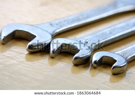 Three Spanner set tools in yellow background