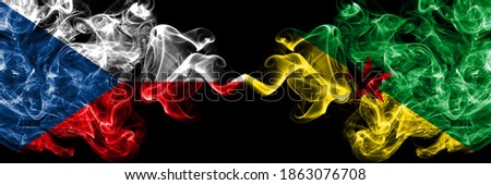 Czech Republic, Czech vs France, French Guiana smoky mystic flags placed side by side. Thick colored silky abstract smoke flags.