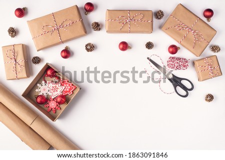 Preparation for Christmas concept. Top above overhead close up view photo of accessories for wrapping gift boxes lying on white desk background