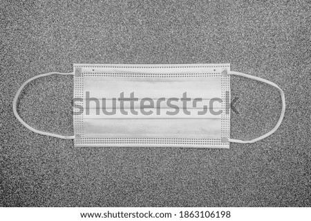 Antibacterial medical mask of white color on a grey background. Coronavirus Protection concept. Hight quality photo
