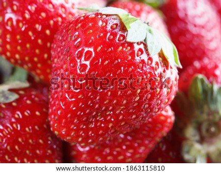 ripe juicy, fresh strawberry macro as food background