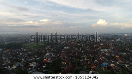 densely populated settlements and morning sunlight
