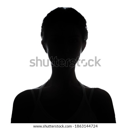 Female person silhouette in the shadow, back lit light Royalty-Free Stock Photo #1863144724