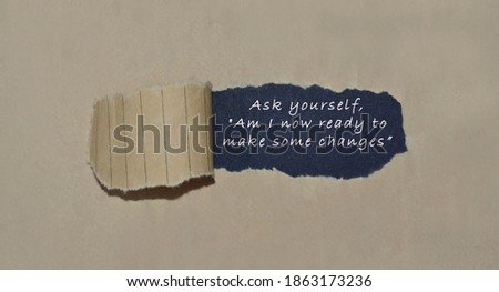 Motivational quote written on brown torn paper - Motivational concept
