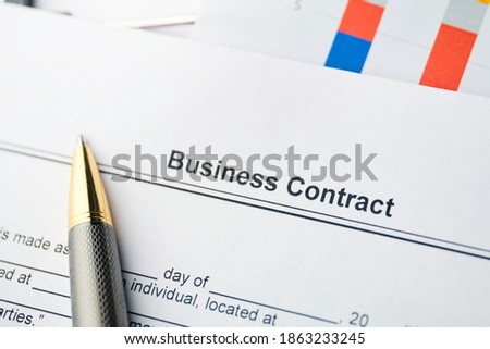 Legal document Business Contract on paper with pen.