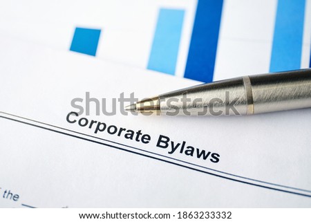 Legal document Corporate Bylaws on paper with pen.