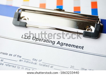 Legal document LLC Operating Agreement on paper. Royalty-Free Stock Photo #1863233440