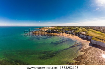Drone aerial view of the beach and white cliffs on sunny day, Margate, England, UK Royalty-Free Stock Photo #1863253123