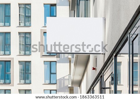 Blank hanging business wall sign, modern style outdoor signage with copy space to add company logo or text 