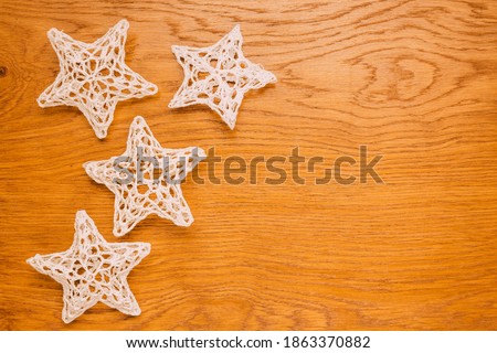 traditional crochet Christmas tree decorations, wooden background, christmas, flat lay
