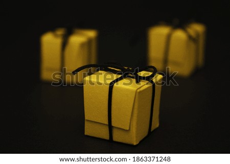 small gift boxes on a black background