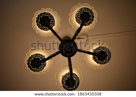picture of a chandelier clicked with warm lighting 