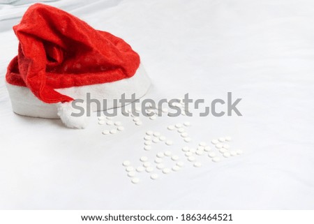 Stay home lettering made from round white pills. White background. High quality photo