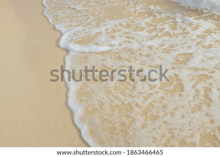 Sea wave on white sand beach summer vacation background